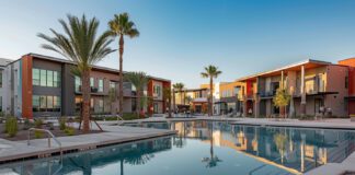 Daytime view of Tucson Lofts with upscale design, swimming pool, and landscaped grounds.